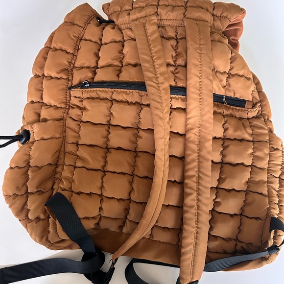 FP Movement by Free People Quilted Puffer Backpack in Rust Orange
